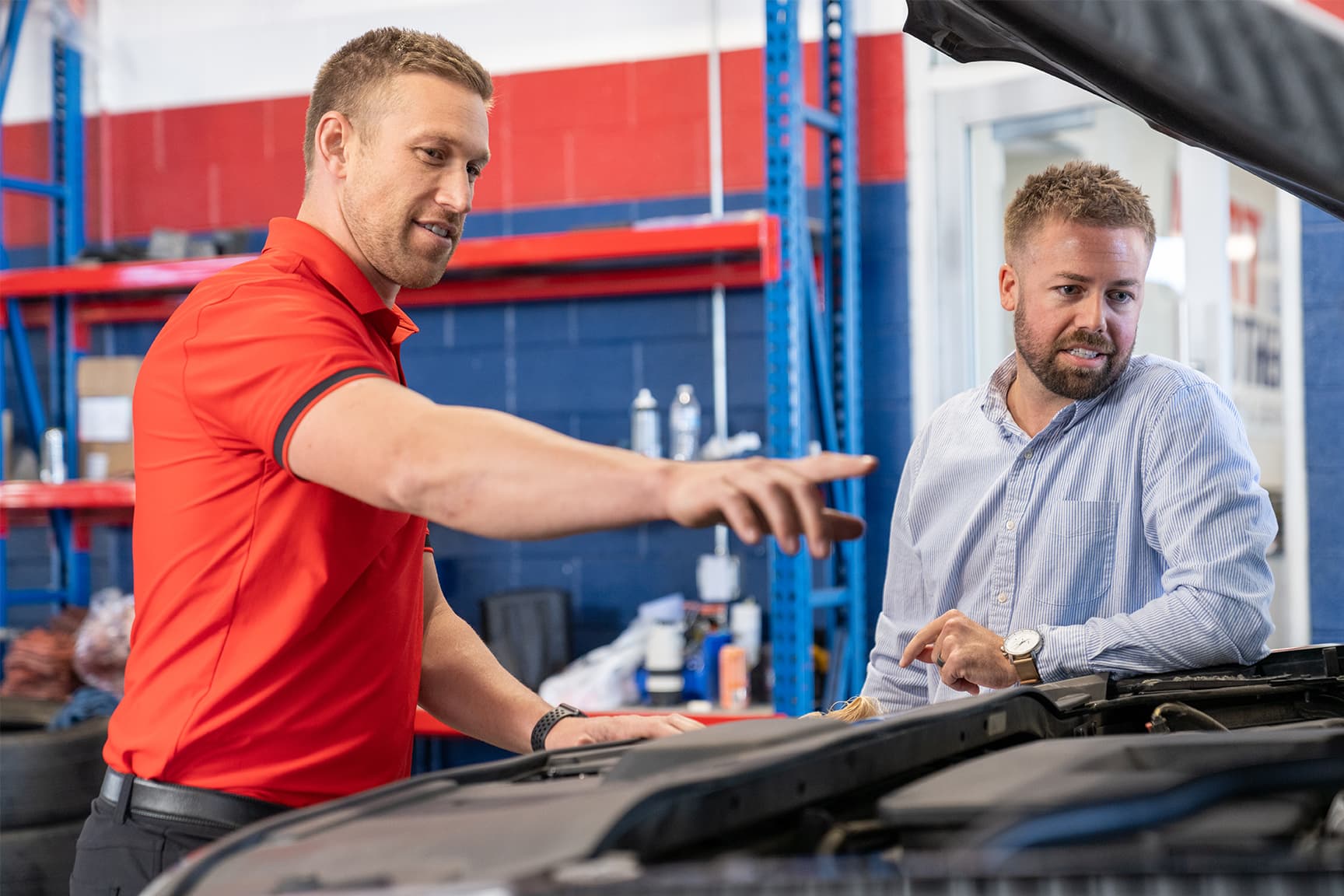 Burt Brothers technician pointing out tip to customer