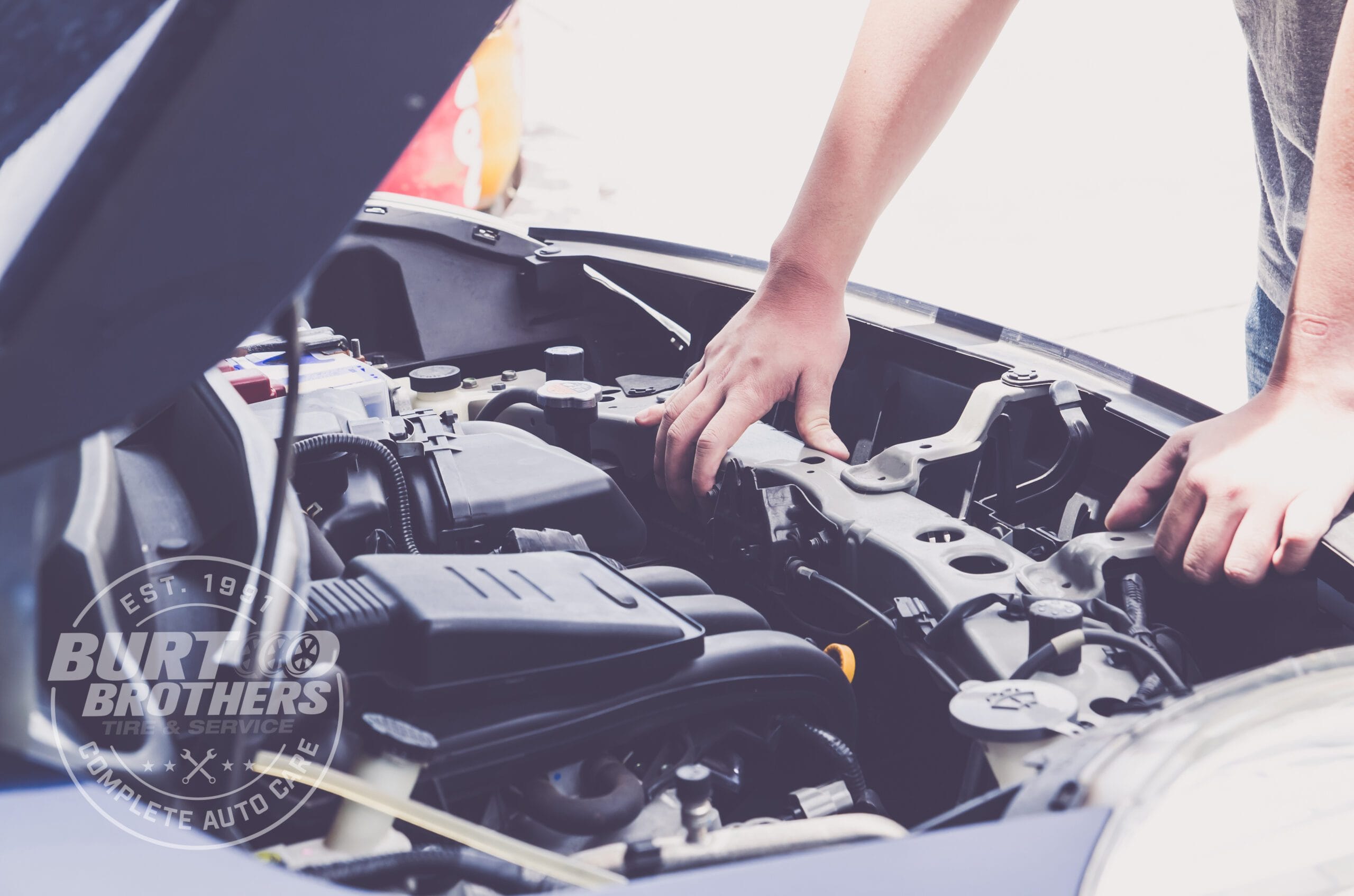 Man hands hold radiator under car hood
