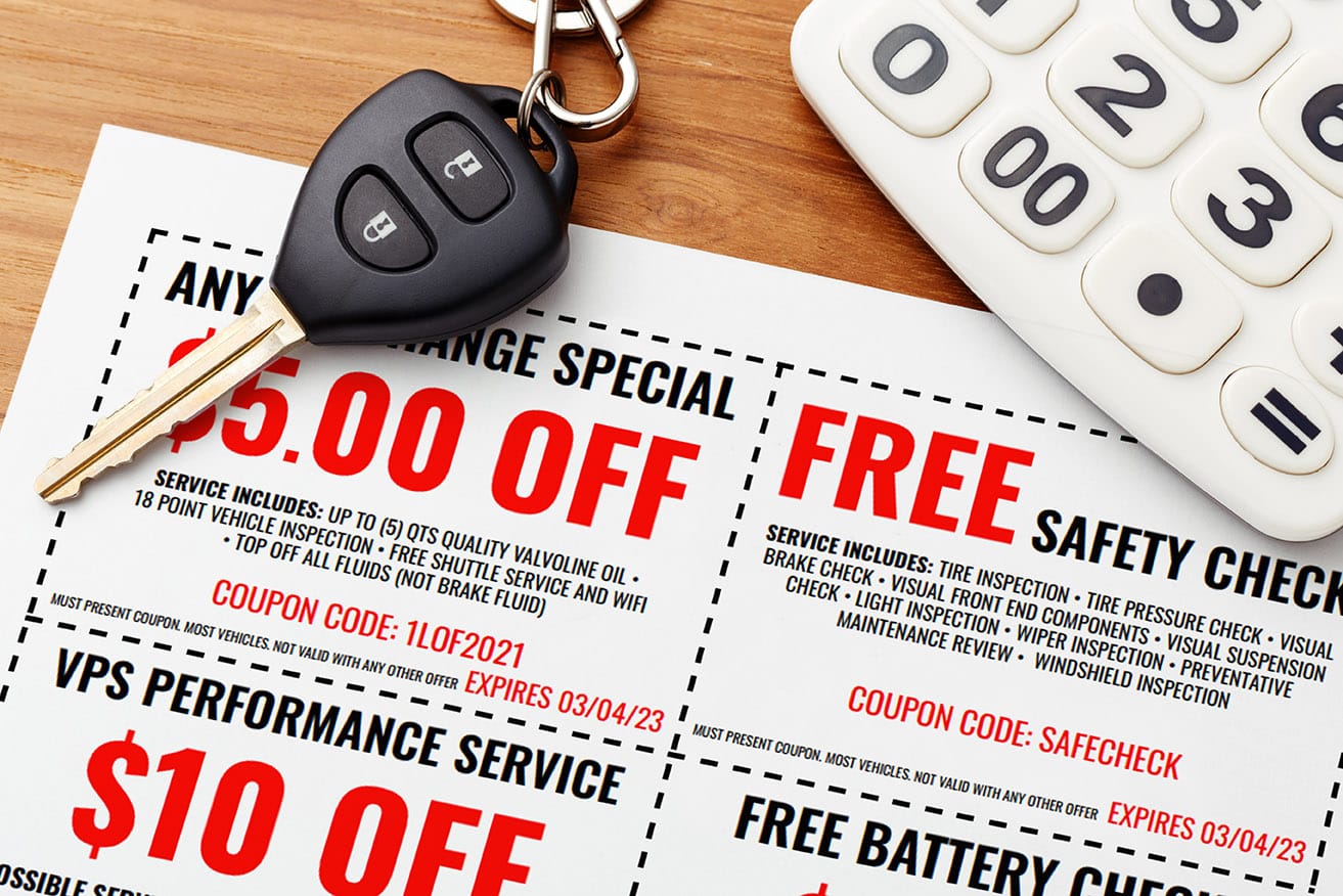 Car fob keys on top of Burt Brothers Coupons