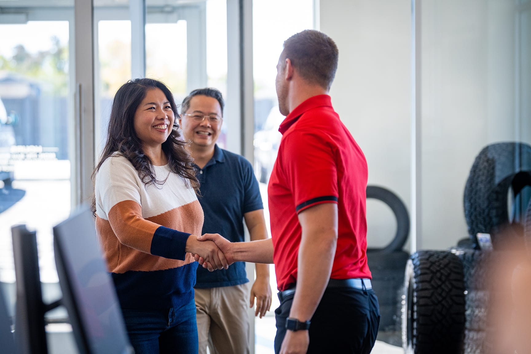 Burt Brothers customers shaking hands with rep
