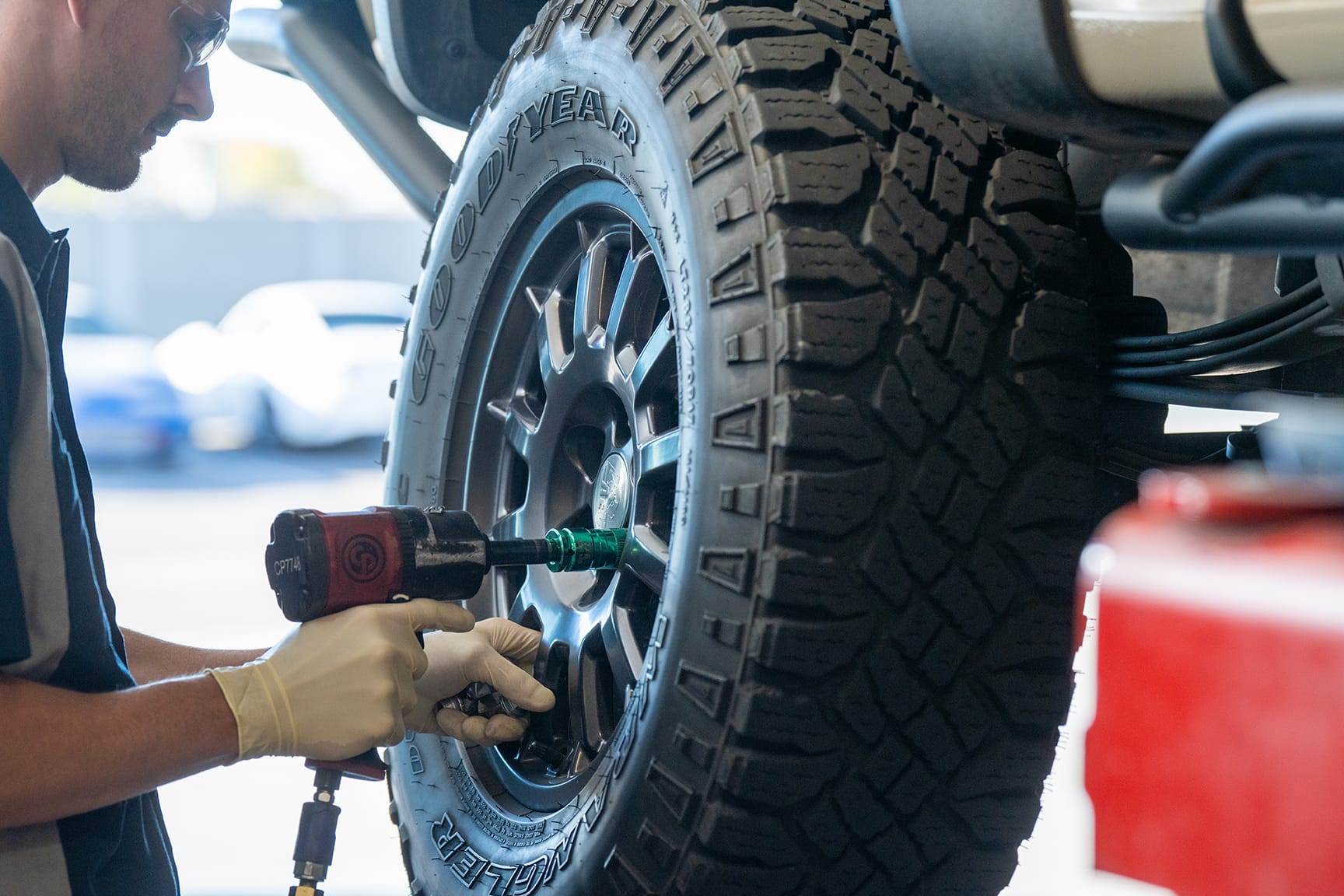 Burt Brothers technician mounting new tire